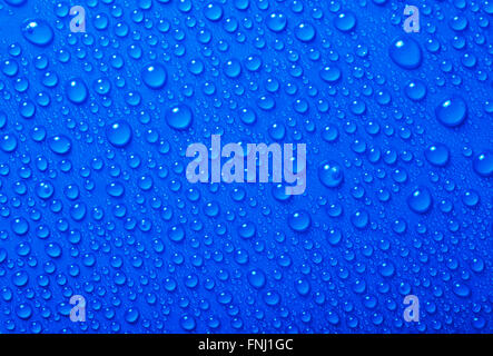 Water Drops On Blue Background Stock Photo