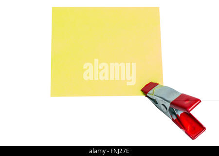 Note paper and macro clip red color isolated on white background Stock Photo