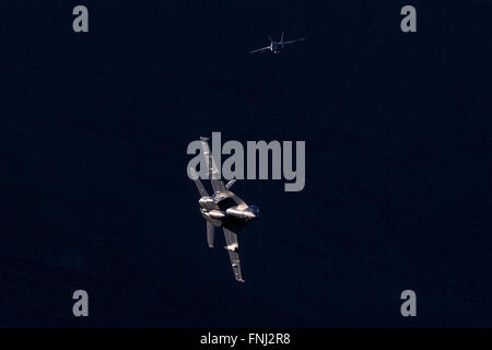 US Navy Boeing F/A-18E Super Hornets NJ-255 and NJ-276 from Strike Fighter Squadron 122 (VFA-122) the 'Flying Eagles' fly into the Jedi Transition over Rainbow Valley, Death Valley National Park, California, United States of America Stock Photo