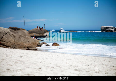 Teens on Rock at Clifton Third Beach in Cape Town - South Africa Stock Photo