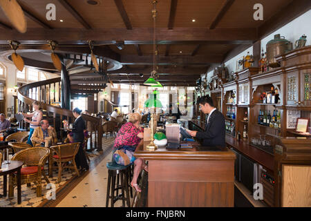 Interior of the famous Long Bar In Raffles hotel, Singapore Stock Photo
