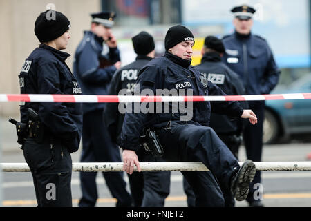 Berlin, Germany. 15th Mar, 2016. Police officers stand guard near the site of the car explosion in Berlin, Germany, on March 15, 2016. A car explosion caused by an explosive device in the German capital on Tuesday has killed the driver, German broadcaster ARD reported. Credit:  Zhang Fan/Xinhua/Alamy Live News Stock Photo