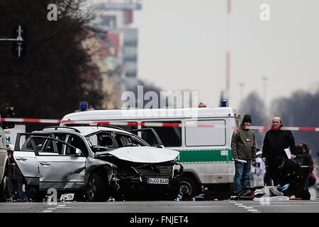 Berlin, Germany. 15th Mar, 2016. Investigators work at the site of the car explosion in Berlin, Germany, on March 15, 2016. A car explosion caused by an explosive device in the German capital on Tuesday has killed the driver, German broadcaster ARD reported. Credit:  Zhang Fan/Xinhua/Alamy Live News Stock Photo