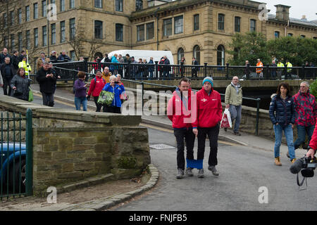 Saltaire, UK. 15th March, 2016. Look North television presenter Harry Gration (right) and Look North weather man Paul Hudson (left) in Saltaire on day six of their charity three legged walk around Yorkshire for Sport Relief. Credit:  Ian Lamond/Ģ����ý Live News Stock Photo