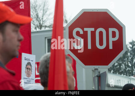 Ruhstorf, Germany. 15th Mar, 2016. A stop sign pictured during a rally held against the planned job cuts at the Siemens plant in Ruhstorf, held in front of the plant premises in Ruhstorf, Germany, 15 March 2016. Siemens had announced last week that it intends to slash or move 2500 jobs, with 2000 of them expected to affect employees in Germany. 700 of the jobs are located in Ruhstorf. Photo: ARMIN WEIGEL/dpa/Alamy Live News Stock Photo