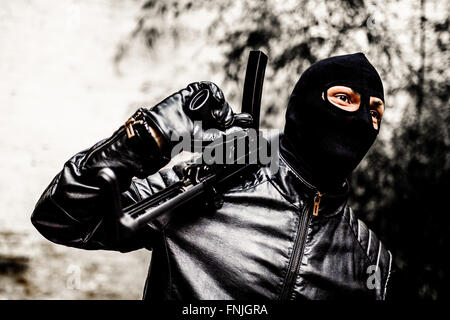 A man with a submachine gun, Germany, Berlin, 20. May 2015. Photo: picture alliance/Robert Schlesinger Stock Photo