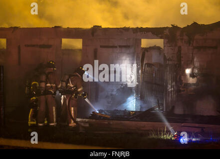 Lake Worth, Florida, USA. 16th Mar, 2016. A two-alarm fire destroyed a 200 foot-long barn at the South Florida Trotting Center in Western Lake Worth. The fire started around midnight and caused the roof to collapse. The fate of thirty horses in the barn are unknown at this time according to Palm Beach County Fire Rescue Capt. Albert Borroto. Credit:  Allen Eyestone/The Palm Beach Post/ZUMA Wire/Alamy Live News Stock Photo