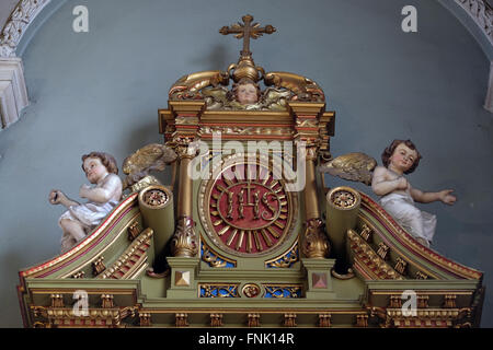 IHS sign on the altar in the Basilica of the Sacred Heart of Jesus in Zagreb, Croatia Stock Photo