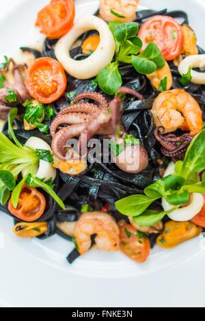 Italian Black Pasta Sea Food Dinner. Italian Kitchen Idea. Stock Photo