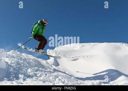 Sofia, Bulgaria - March 12, 2016: Freestyle skier is jumping from the top of a peak of Vitosha mountain. He is participating in  Stock Photo