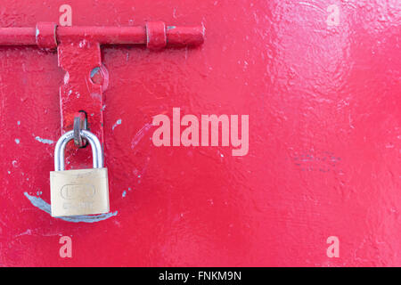 Red door with a lock locked Stock Photo