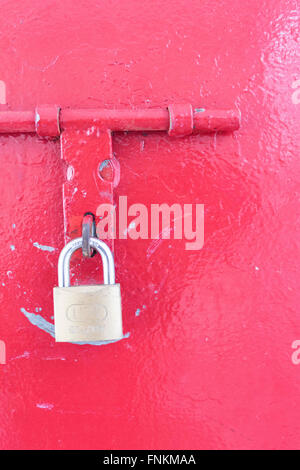 Red door with a lock locked Stock Photo