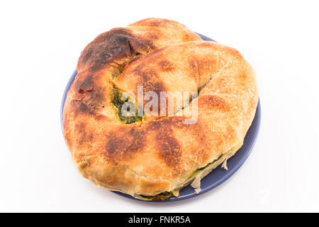 Snail pie with spinach and cheese. Stock Photo