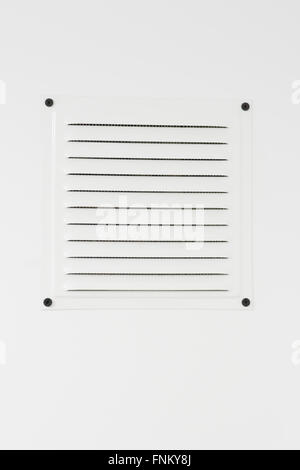 Close-up of plastic air vent in white wall Stock Photo