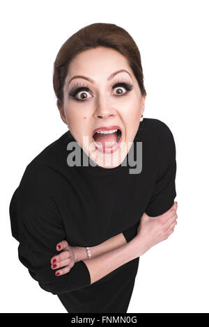 model looking at the camera in surprise, Model hugging herself stares open-mouthed chamber Stock Photo