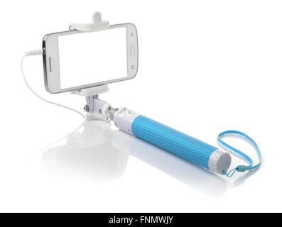 Selfie stick with smartphone isolated on white Stock Photo