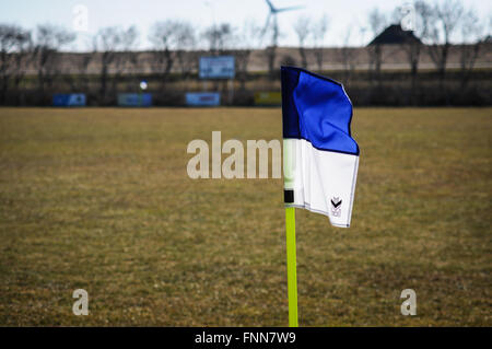 Blue and white corner flag on soccer field Stock Photo