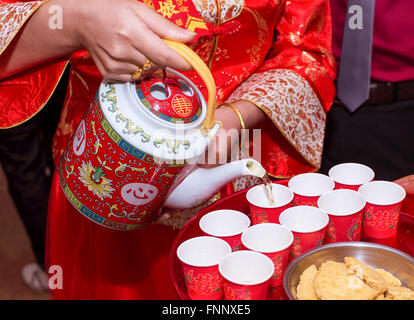 the bride serving the tea for the elders Stock Photo