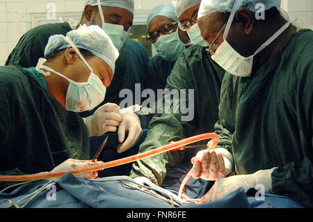 Close up of surgeons performing an operation. Stock Photo