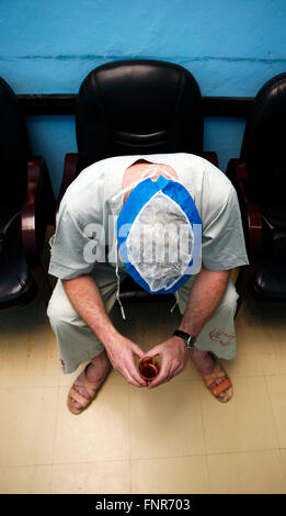 Tired surgeon resting after a long surgery Stock Photo