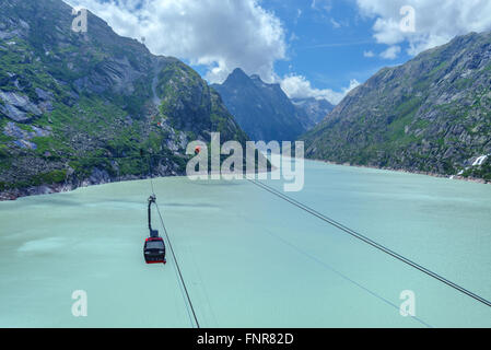 Great view from the top of the Grimsel pass over the Grimselsee dam. Switzerland, Bernese Alps, Europe. Stock Photo