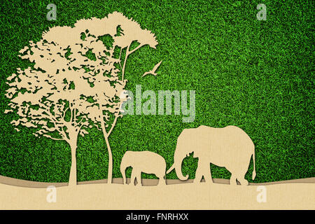 African wildlife illustration made of cardboard on green grass. Stock Photo