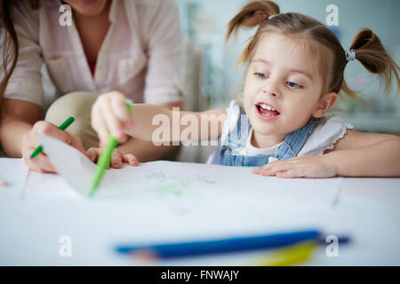 Cute little girl drawing a picture Stock Photo