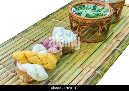 a photo of Natural silks and product from silkworm in basket, Selective focus on silk Stock Photo
