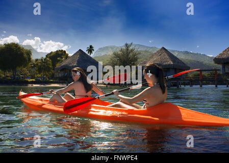 Two nice girls doing kayak in front of Meridien Hotel on the island of Tahiti, French Polynesia, Tahiti Nui, Society Islands, Fr