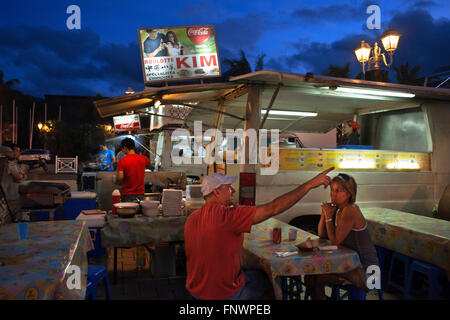 Outdoor dining in a plaza among roulotte food vans at Papeete on the island of Tahiti, Tahiti Nui, Society Islands, French Polyn Stock Photo