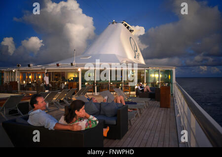 Guests in the dock of Paul Gauguin cruise anchored in Fakarava, Tuamotus Archipelago French Polynesia, Tuamotu Islands, South Pa Stock Photo