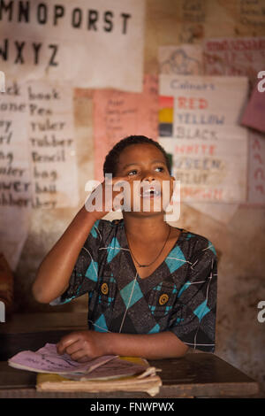 A girl answers a question in her classroom in a school in Finote Selam Ethiopia Africa Stock Photo