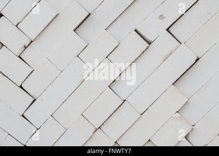 Bricks stacked in a warehouse building base Stock Photo