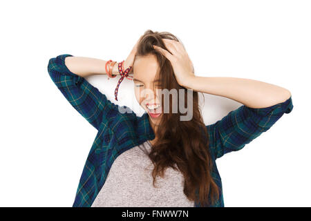 happy pretty teenage girl holding to head Stock Photo