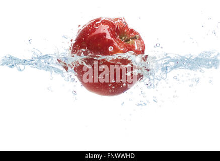 apple falling or dipping in water with splash Stock Photo