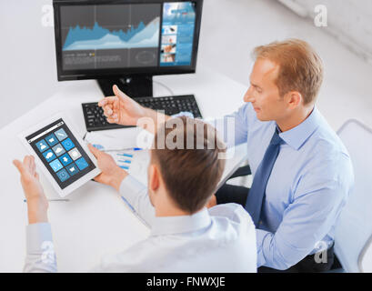 businessmen tablet pc using applications at office Stock Photo