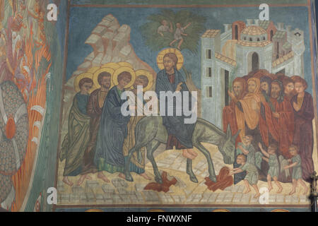 Entry of Christ into Jerusalem. Mural painting by Russian icon painters Rostislav Koryakin (1918-1999) and Andrei Ryazanov (1885-1950) in the Dormition Church at the Olsany Cemetery in Prague, Czech Republic. The Dormition Church designed by Russian architect Vladimir Brandt (1887-1944) was built in 1924-1925 by the Russian white emigration in Czechoslovakia. Mural paintings were realised in 1941-1945 by group of Russian icon painters after design by famous Russian book illustrator Ivan Bilibin (1876-1942) from 1926-1928. Stock Photo