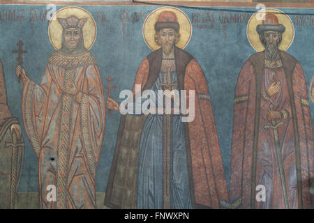 Saint Olga of Kiev, Saint Alexander Nevsky and Saint Michael of Chernigov. Mural painting by Russian icon painter Andrei Ryazanov (1885-1950) in the Dormition Church at the Olsany Cemetery in Prague, Czech Republic. The Dormition Church designed by Russian architect Vladimir Brandt (1887-1944) was built in 1924-1925 by the Russian white emigration in Czechoslovakia. Mural paintings were realised in 1941-1945 by group of Russian icon painters after design by famous Russian book illustrator Ivan Bilibin (1876-1942) from 1926-1928. Stock Photo