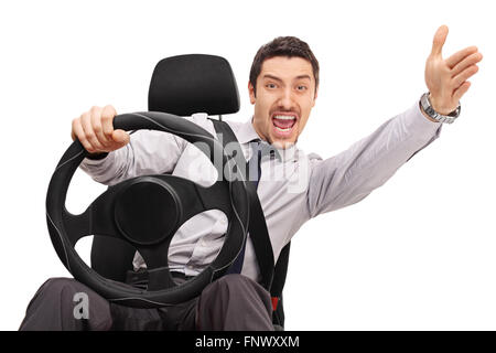 Displeased young man driving and arguing with someone isolated on white background Stock Photo