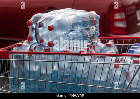 Drinking bottled water drinking water plastic bottles in shopping cart water bottles in supermarket trolley Stock Photo