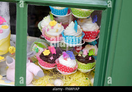 easter theme cupcakes on display in bakery window Stock Photo