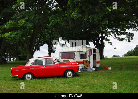 classic camping in 1970s Morris Oxford at Charlbury Cotswolds United Kingdom Stock Photo