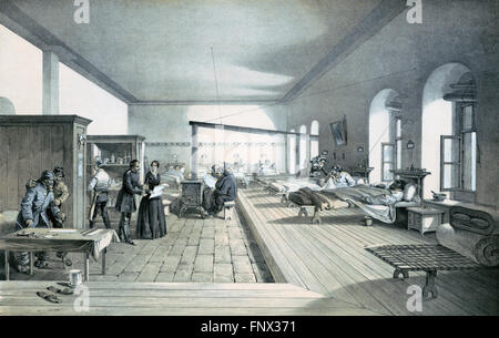 Florence Nightingale in one of the wards of the hospital at Scutari, Turkey (formerly Ottaman Empire) during the Crimean War. Lithograph by E Walker from an illustration by William Simpson, 1856. Stock Photo
