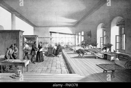 Florence Nightingale in one of the wards of the hospital at Scutari, Ottaman Empire (now Turkey) during the Crimean War. Lithograph by E Walker from an illustration by William Simpson, 1856. Stock Photo