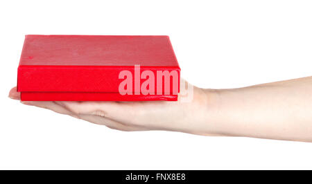 red box in a female hand on a white background Stock Photo
