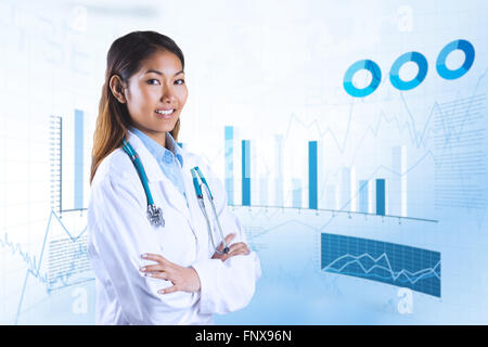 Composite image of asian doctor with arms crossed looking at the camera Stock Photo