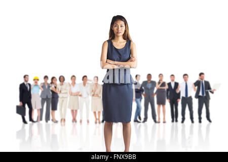 Composite image of businesswoman with crossed arms Stock Photo