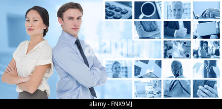 Composite image of business colleagues with arms crossed in office Stock Photo