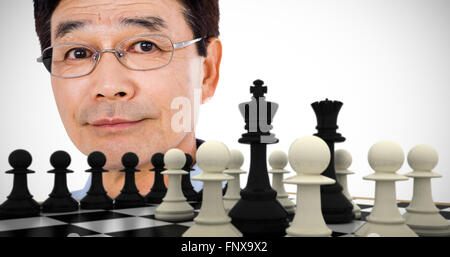 Composite image of close-up portrait of confident man wearing eyeglasses Stock Photo