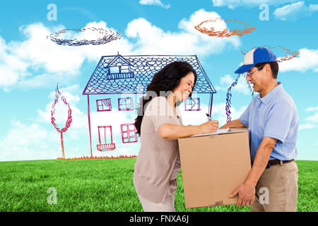 Composite image of woman signing for a package Stock Photo